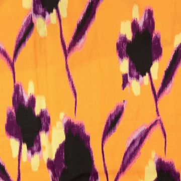 Paarse bloem op oranje